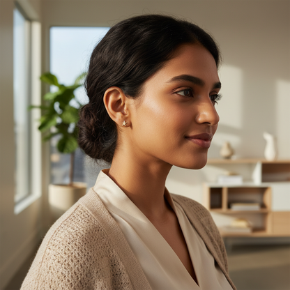 Indian woman wearing delicate gold star stud earrings