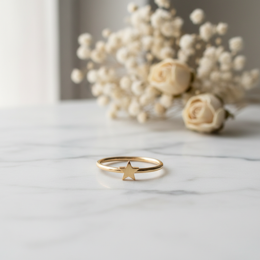 Celestial star midi ring on white marble surface